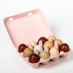 Open soft pink vintage-style 12-egg chicken carton filled with eggs.